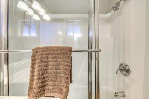 a bathroom with a shower with a towel at Half-Mi to Midtown Family Retreat with Mtn Views! in Ruidoso +26 photos