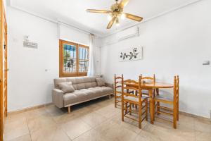 a living room with a couch and a table at Casa Calma in Santa Pola