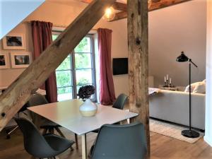 a room with a table and chairs and a bed at Ferienwohnung mit Sauna in Potsdam