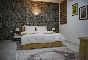 Postel nebo postele na pokoji v ubytování Hotel Alisa