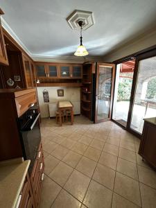 a kitchen with a table and a dining room at Luxury Villa Neighboring Oludeniz in Fethiye