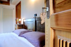 Postel nebo postele na pokoji v ubytování La Vrille - chambres d'hôtes