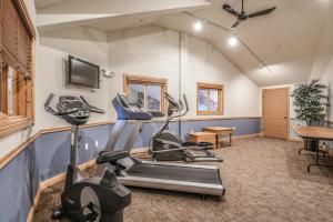 a gym with exercise equipment in a room at Hidden River Lodge 5981 by SummitCove Lodging in Keystone