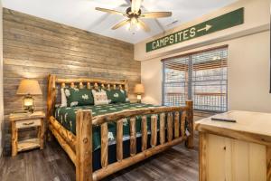 a bedroom with a wooden bed and a ceiling fan at Cozy Cabin w Water View-Community Indoor Pool-Connect4-Bunk Room-Free Attraction Tickets in Hollister +41 photos