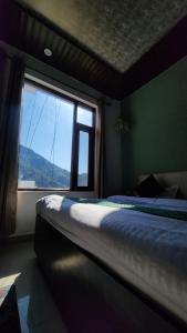 Ліжко або ліжка в номері Hotel Mahadev