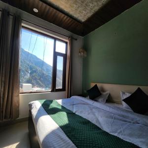 Ліжко або ліжка в номері Hotel Mahadev