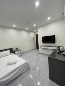 TV a/nebo společenská místnost v ubytování Ami Home Đội Cấn