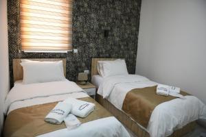 Postel nebo postele na pokoji v ubytování Hotel Alisa