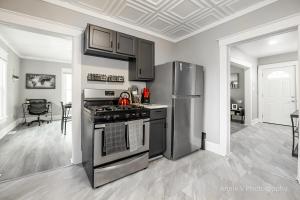 a kitchen with a stainless steel stove and refrigerator at Hannahs Haven in Lima