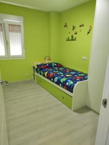 Ένα ή περισσότερα κρεβάτια σε δωμάτιο στο Piso en Valadouro