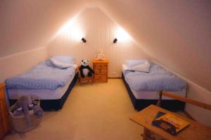 Voodi või voodid majutusasutuse Ferienwohnung Marin - Inselhof Fehmarn toas