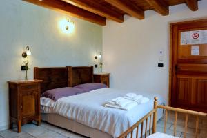 Postel nebo postele na pokoji v ubytování La Vrille - chambres d'hôtes