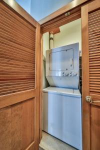 a kitchen with a refrigerator and a microwave at Rocky Mountain Retreat Steps to Slopes with Hot Tub and Spectacular Views in Winter Park
