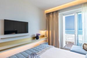 TV a/nebo společenská místnost v ubytování Hotel Tiffany's