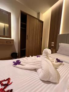 Postel nebo postele na pokoji v ubytování Amigo Pyramids Hotel