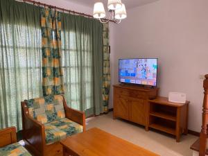 A television and/or entertainment centre at Casa Teresa. Duplex en Maspalomas