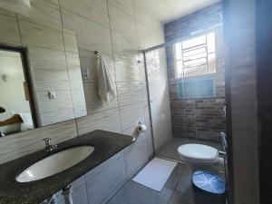 a bathroom with a sink and a toilet at Hotel Montanhas de Minas in Diamantina +277 photos