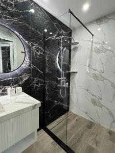 a bathroom with a shower and a sink at Center Park Apartment in Sandanski +26 photos