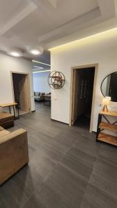 a large room with two doors and a room with a table at Modern Well Renovated apartment in The heart of City Center , Open Balcony by Republic Square in Yerevan +25 photos