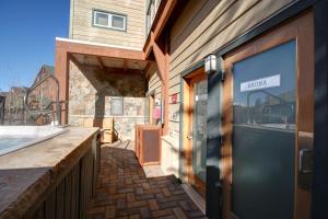 a door to a building with a balcony at Black Bear 8035 by SummitCove Lodging in Keystone
