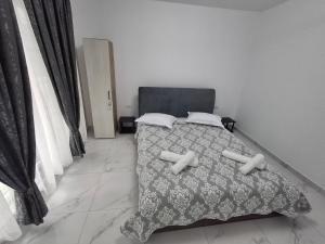Postel nebo postele na pokoji v ubytování Casa Niko