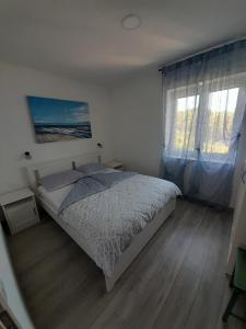 Postel nebo postele na pokoji v ubytování Apartman RUBY