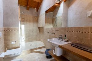 a bathroom with a sink and a shower and a toilet at B&B La Pentola dei Sogni in Scanzorosciate +35 photos