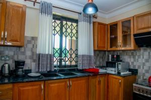 Kuchyň nebo kuchyňský kout v ubytování Spring Apartments & Suites