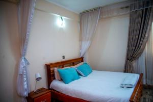 Postel nebo postele na pokoji v ubytování Spring Apartments & Suites
