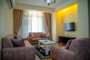 TV a/nebo společenská místnost v ubytování Spring Apartments & Suites