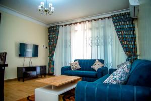 TV a/nebo společenská místnost v ubytování Spring Apartments & Suites