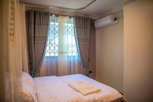 Postel nebo postele na pokoji v ubytování Spring Apartments & Suites