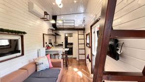 a living room and kitchen in a tiny house at Loft Black Sapanca in Sapanca