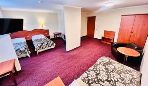 Posteľ alebo postele v izbe v ubytovaní Hotel Krakus