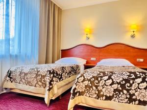 Posteľ alebo postele v izbe v ubytovaní Hotel Krakus