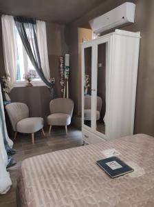 Rúm í herbergi á Affittacamere Il Vecchio Gozzo