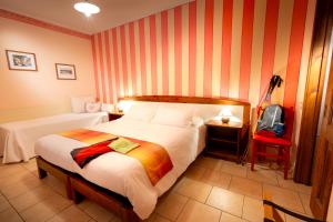 A bed or beds in a room at Cascina La Commenda