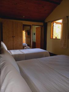 Postel nebo postele na pokoji v ubytování Pousada Viajantes do Tempo + 37 fotografií