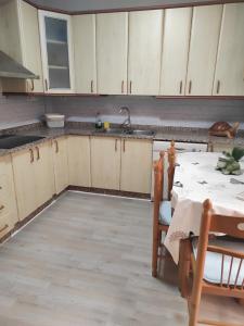 an empty kitchen with a table and a sink at Apartamento en Ejido Centro in El Ejido