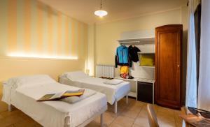 A bed or beds in a room at Cascina La Commenda