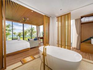 Postel nebo postele na pokoji v ubytování Beachfront Villa 3-bedroom - Breakfast buffet