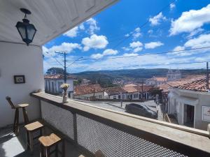 a balcony with a view of a city at POUSADA FLOR DE LIS in Diamantina
