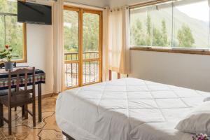 Postel nebo postele na pokoji v ubytování Sueños del Valle Sagrado