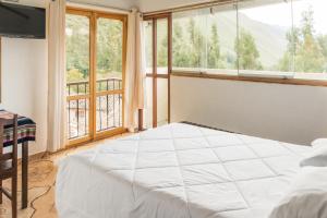 Postel nebo postele na pokoji v ubytování Sueños del Valle Sagrado