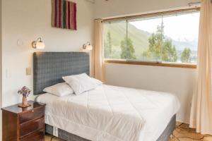 Postel nebo postele na pokoji v ubytování Sueños del Valle Sagrado
