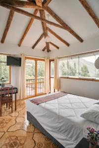 Postel nebo postele na pokoji v ubytování Sueños del Valle Sagrado