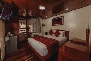 Un pat sau paturi într-o cameră la Quechua Hotel Cusco