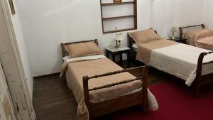 Postel nebo postele na pokoji v ubytování Casa Rosa 8
