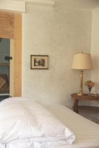 Boutique-Hotel Guesthouse Le Locle客房内的一张或多张床位