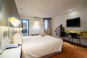 TV a/nebo společenská místnost v ubytování Uniclass Hotel Pinheiros
